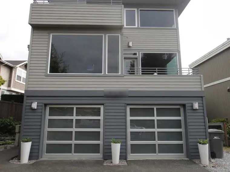 After: full-view doors with clear glass, in step with the windows