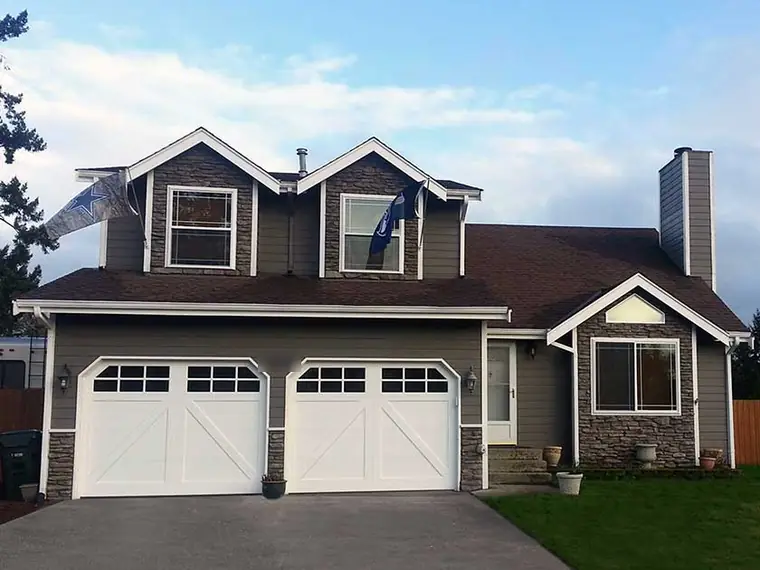 After: white carriage-style doors with a row of lights across the top
